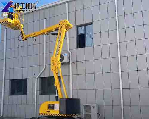small articulating boom lift in exterior wall of building