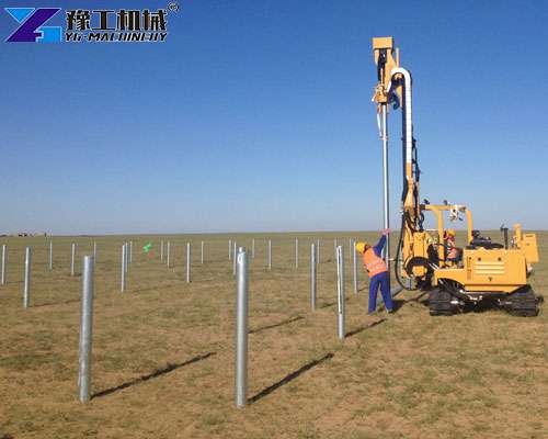 solar pile driver working on solar farm construction site