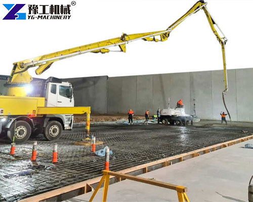 concrete boom pump working on construction site