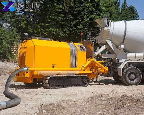 crawler concrete pump working on mountain road construction site