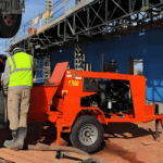 concrete pump delivering concrete to high rise building floors