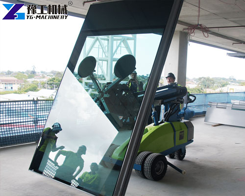 operator controlling glass lifting robot via wireless remote system