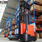 stacker operating in warehouse aisle