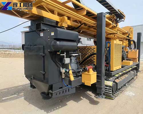 Crawler RC drilling rig moving across difficult terrain for mineral exploration