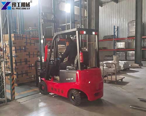 Electric forklift handling materials in a manufacturing plant