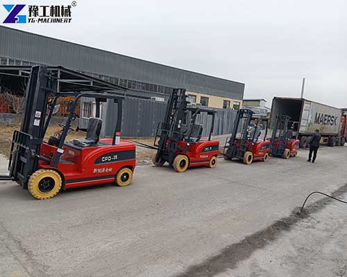 Four electric forklifts prepared for shipment to Colombia