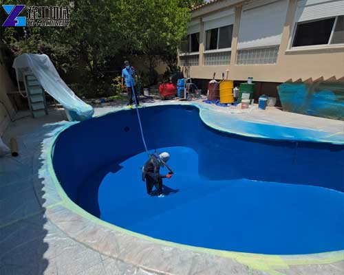 Polyurea spray machine applying waterproof coating to a concrete pool