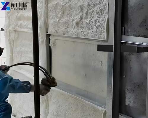 PU spray machine applying polyurethane foam for roof insulation