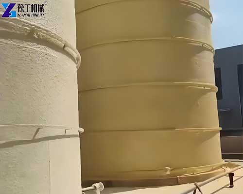 PU spray machine applying polyurethane foam to an industrial tank