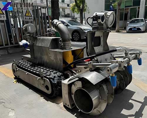 Operator controlling a remote sedimentation tank cleaning robot with camera monitoring