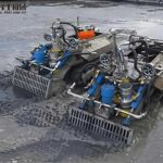 Sedimentation tank dredging robot removing settled sludge in a wastewater treatment plant