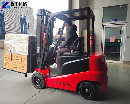 Small electric forklift used for material handling in a workshop