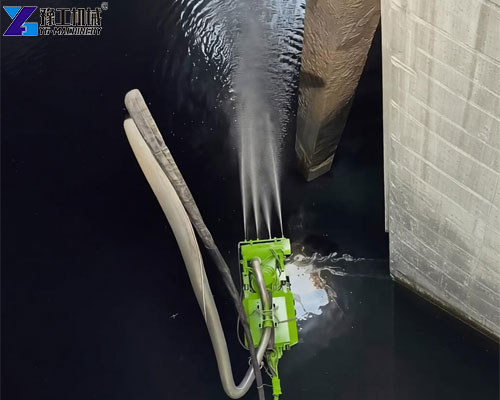 Remote-controlled sludge removal robot operating inside a concrete tank